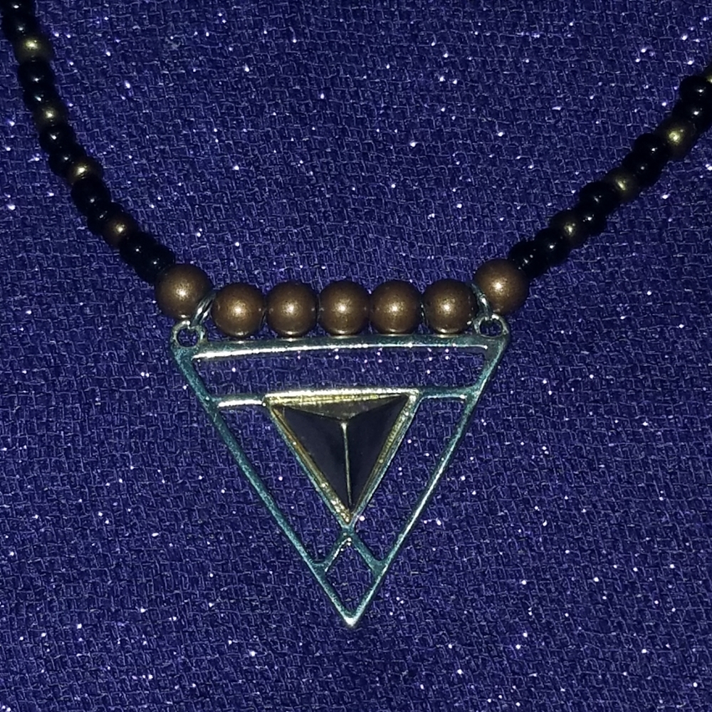 Black, silver, copper and gold triangle ne…
